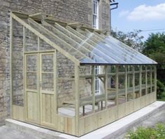 a wooden house with a glass roof