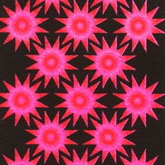 a black background with pink and red stars in the shape of an abstract design on it