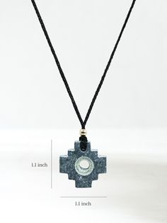 A chakana talisman necklace made of Machu Picchu stone, with the Andean symbol of the Incan civilization. Derived from the Quechua (traditional language of the Incas) word chakay, meaning to cross or to bridge, this chakana is a 3-stepped symmetric cross, with a hole through its center. Strung on soft black cord. Machu Picchu stone is a type of serpentine found in the area around Machu Picchu. Each item is unique and handmade in Peru. Traditional Etched Adjustable Necklace, Adjustable Engraved Necklaces For Rituals, Traditional Adjustable Cross Jewelry, Adjustable Medallion Necklaces For Healing, Adjustable Symbolic Necklaces With Natural Stones, Adjustable Medallion Necklace For Healing, Adjustable Fair Trade Spiritual Jewelry, Artisan Medallion Necklace For Meditation, Traditional Cross Pendant Necklace As Gift