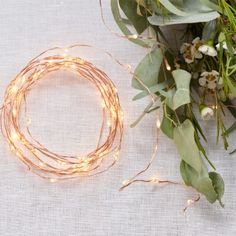 a bunch of flowers sitting on top of a table next to a bracelet and ring