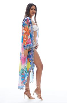 Charm your festival or beach look with this lightweight duster covered in a vibrant flamingo pattern. Open front Kimono-inspired sleeves
 100% polyester
 Hand wash cold, lay flat to dry
 Imported Model stats: 5'10", 32" bust, 25" waist, 36" hip. Model is wearing size One Size. Tropical Long Sleeve Cover-up For Beach Season, Trendy Multicolor Beach Cover-up, Printed Beach Season Festival Cover-up, Printed Festival Cover-up For Beach Season, Printed Cover-up For Beach Festival, Tropical Printed Cover-up For Beach Season, Long Spring Beach Party Cover-up, Spring Festival Swimwear With Tropical Print, Tropical Print Cover-up For Beach Party