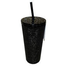 a black and white cup with a straw in it