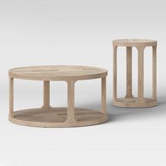 two wooden tables sitting next to each other on a white surface with no one around them