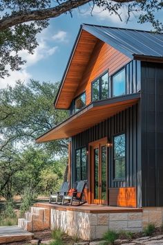 Innovative barndominium design showcasing metal and wood exterior, expansive windows, and architectural flair