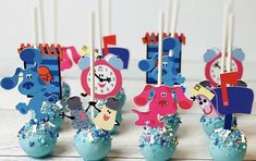 there are some cake pops decorated with cartoon characters