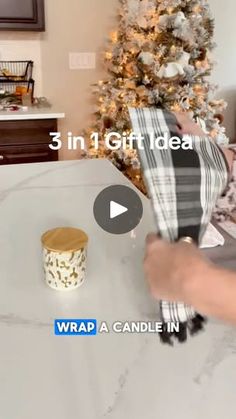 a person is wrapping presents in front of a christmas tree with the words wrap a candle in