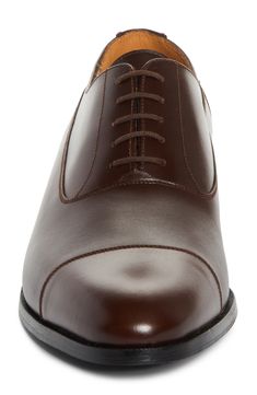 Crafted in France from silky calfskin, this cap-toe oxford boasts a renowned Blake construction and a monogram-debossed sole. Lace-up style Removable, cushioned insole Leather upper, lining and sole Made in France Designer Shoes Timeless Fitted Derby Shoes With Cap Toe, Fitted Derby With Rubber Heel Cap And Cap Toe, Timeless Fitted Derby With Cap Toe, Timeless Cap Toe Derby, Timeless Fitted Cap Toe Derby Shoes, Fitted Cap Toe Derby With Rubber Heel Cap, Timeless Fitted Cap Toe Derby, Fitted Leather Oxford Shoes With Goodyear Welt, Classic Cap Toe Oxford With Leather Sole