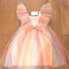 This H And M Tule Dress Is A Dream. It Has Two Layers Of Tule And Then Lined In Light Pink. The Back Is Very Sweet With The Double Layers On Sleeves And The 3 Buttons Going Down. It Has A Couple Of Different Pinks, Blue And A Yellowish Color. Size Kids 10 Tile Dress, Rainbow Tile, Dress With Flutter Sleeves, H And M, Belly Fat Burner Drink, Dream It, Fat Burner, Hm Dress, Flutter Sleeves