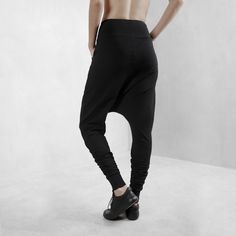 Edgy, cool streetwear style, black harem pants made from certified organic cotton with 10% lycra for comfort, fit and durability. These have a comfy set of side pockets, and a loose fit around the hips and extra volume at the ankle making these the perfect pair of pants for any body type or yoga, lounging, or night life. Totally versatile - create your look based on your need or situation. This cut flatters every body type with a relaxed, edgy, streetwear fit. Look fly AF but basically wearing y Baggy Wide Leg Harem Pants Hip Hop Style, Baggy Wide Leg Hip Hop Harem Pants, Relaxed Fit Full-length Harem Pants For Streetwear, Casual Baggy Drop Crotch Yoga Pants, Baggy Harem Pants For Streetwear, Hip Hop Style, Baggy Harem Pants For Streetwear In Hip Hop Style, Baggy Black Pants For Hip Hop, Baggy Harem Pants For Hip Hop Streetwear, Black Baggy Hip Hop Pants