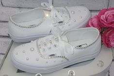 Walk down the aisle in style in or give your feet a rest after a day in heels and dance the night away in these stunning hand embellished custom Vans  wedding sneakers. Elegantly designed with romantic pearls and top quality glass crystals to achieve superb sparkle and shine, each crystal and pearl is individually placed by hand for the finest quality finish. All shoes are custom made to order so please ask for advice on sizing if you are in any way unsure. Please also refer to the international size conversion chart. Pearl Vans, Bride Converse, Wedding Vans, Converse Wedding Shoes, Bridal Sneakers, Wedding Converse, Wedding Sneakers, Custom Bling, Sneakers Vans