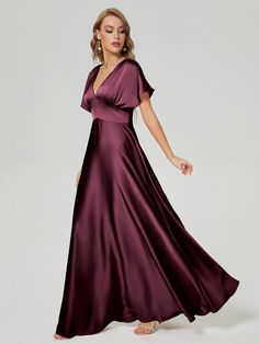 a woman in a long purple dress