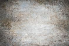 an old grungy textured background in grey and brown tones with white highlights