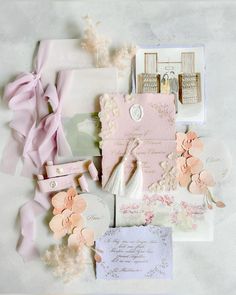 wedding stationery with pink flowers and cards