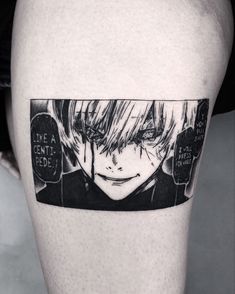 a man's thigh with a black and white photo of an anime character on it