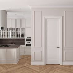 an empty kitchen with white walls and wooden floors, as well as a stove top oven