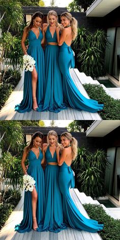 three women in blue dresses posing for the camera