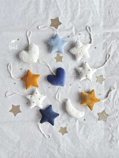 small stars and moon ornaments on white paper