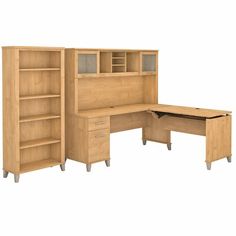 an office desk with bookcases and drawers