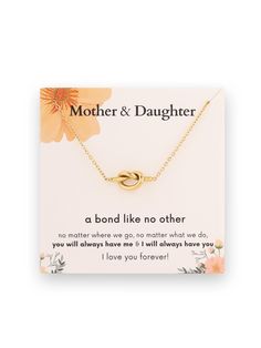 a mother and daughter necklace on a card