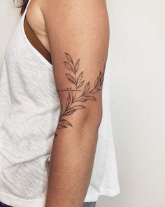 a woman with a tattoo on her arm