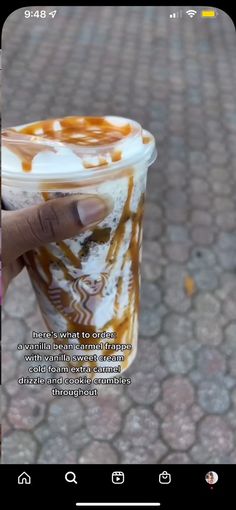 someone is holding up a coffee cup with caramel swirls on it and the caption below