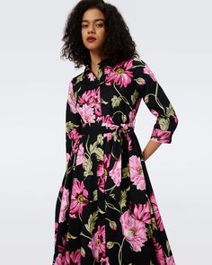 Crafted from a cotton poplin, the Blaine midi dress has a soft and structured feel. This shirt dress has a classic collar, buttons up the front, and three-quarter, cuffed sleeves. Its waist in cinched with a matching tie above a full, A-line skirt. Eloisa is 5 Foot and 8 Inches and wearing a size XS. Spring Floral Print Dress With Collared Neckline, Cotton Floral Print Shirt Dress For Work, Cotton Midi Dress With Floral Print For Work, Daywear Dress With Spread Collar, Spring Cotton Collared Midi Dress, Elegant Cotton Shirt Dress With Floral Print, Formal Collared Floral Print Dress, Formal Collared Dress With Floral Print, Cotton Dress With Button Closure And Spread Collar