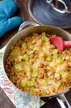 a casserole dish with celery and meat in it on a table