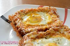 two fried eggs are sitting on a white plate