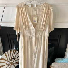 Cream Summer Midi Dress Beige V-neck Lined Midi Dress, Cream V-neck Dress For Day Out, Cream V-neck Lined Dresses, Beige V-neck Rayon Dress, Cream Short Sleeve Maxi Dress For Spring, Cream Midi Dress For Spring Daywear, Summer Cream Midi Dress, Cream Midi Dress For Summer, Cream Mid-length Summer Midi Dress