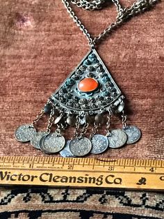 "Vintage tribal necklace that has a carnelian cabochon center stone . Set in a white metal alloy. Circa 1970's . Measurements are; Pendant with tassels 4\" X 2\" Chain 24\" 16\" drop" Providence Ri, Carnelian Stone, White Metal, Tassels, Vintage Jewelry, Pendant Necklace, Drop Earrings, Chain, Stone