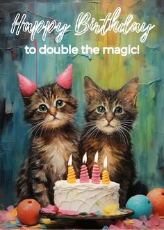 two kittens are sitting in front of a birthday cake