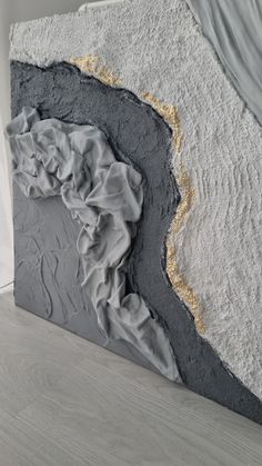 a large piece of art that looks like it is made out of concrete and cement