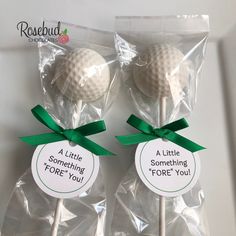 two golf ball lollipops wrapped in cellophane