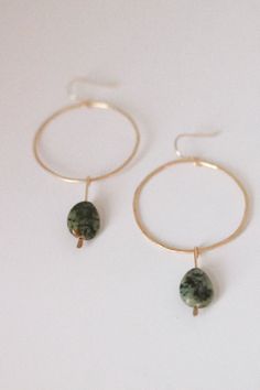 Reminiscent of golden hours on the beach, turquoise waters, tan skin and chilled fruits Inspired by coastal havens, the ALSTON hoops will bring out the bohemian barefooted spirit in whomever they adorn. Hand forged gold fill hoops with Turquoise gems . Made to order  2 inches in diameter Green Hoop Earrings For Beach, Green Hoop Earrings For The Beach, Teardrop Hoop Earrings With Ear Wire For Beach, Green Bohemian Hoop Earrings Hypoallergenic, Bohemian Green Hoop Earrings Hypoallergenic, Bohemian Green Hypoallergenic Hoop Earrings, Green Bohemian 14k Gold Filled Earrings, Handmade Small Hoop Earrings For Vacation, Handmade Small Hoop Jewelry For Vacation