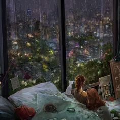 a dog sitting on top of a bed in front of a window with city lights