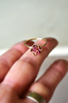 Unique raw Ruby ring in 14K yellow gold fill. My bestselling lotus ring design, now in yellow gold or fill! A handcrafted 14K gold fill band with my etched cup filled with raw Ruby chips in a mosaic pattern, my signature design. Organic, natural ruby reds in varying shades look pretty and unique next to the yellow gold color. Ruby is July's birthstone. Made to order, to size. Scroll to read all the details. I love this ring as sparkly, any occasion present for her, Women's July birthstone gift f Spiritual Gold Birthstone Ring For Wedding, Spiritual Yellow Gold Stackable Rings For Wedding, Yellow Gold Stackable Wedding Rings, Gold Sterling Silver Ruby Ring For Wedding, Gold Ruby Ring In Sterling Silver For Wedding, Flower Shaped Ruby Ring In Yellow Gold For Wedding, Wedding Fine Jewelry Birthstone Ring In Recycled Gold, Wedding Ruby Ring In Gold And Sterling Silver, Handmade 14k Gold Flower Ring