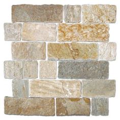 an image of a wall made out of different colored stone tiles, including beige and brown