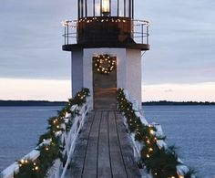 the light house is decorated with christmas lights