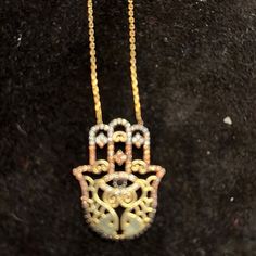 This Hamsa Necklace Is Gold Vermeil Over S/S. The Hamsa Is Protective Tallisman That Brings Good Fortune, Health And Happiness. It Protects From The Evil Eye The Necklace Measures 16 Inches With A 2 Inch Extension. The Pendant Measures 3/4inches Across And 1 1/4 Inches High. The Hamsa Has Clear And Colored Crystals. Gorgeous On! Nwt. Bohemian Silver Necklaces With Hand Set Details, Bohemian Silver Necklace With Hand Set Details, Adjustable Hand Set Silver Necklaces, Adjustable Hand Set Silver Necklace, Layered Coin Necklace, Sun And Moon Necklace, Dior Necklace, Silver Coin Necklace, Zodiac Pendant Necklace