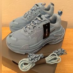 Balenciaga Triple A Sneakers Women’s Light Blue Brand New With Box Luxury Chunky Sneakers With Translucent Outsole For Streetwear, Trendy Blue Platform Sneakers For Sports, Light Blue Sneakers For Streetwear, Trendy Blue Platform Sneakers With Rubber Sole, Shoes Balenciaga, Balenciaga Shoes, Sneakers Women, Light Blue Color, Womens Shoes Sneakers