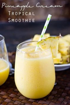 pineapple cream tropical smoothie in a glass with a straw