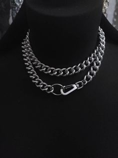 Make an edgy statement with this stunning Chunky Chain Goth Choker Layered Necklace Set! Crafted with steel curb chain and stainless steel push clasp, this modern and sophisticated necklace comes with a bit of punk rock edge, perfect to challenge your style. Light up any outfit and rock the night away! Wear long or doubled as a choker. Total length end-to-end is approximately 32 inches. Cheap Punk Choker For Festivals, Metal Chain Link Necklace For Streetwear, Punk Chain Necklace For Streetwear, Edgy Metal Necklaces For Streetwear, Metal Chain Necklace For Streetwear, Metal Link Necklaces For Streetwear, Streetwear Necklace With Chunky Chain Link, Punk Silver Chain Necklace For Streetwear, Punk Style Adjustable Chain Link Necklace