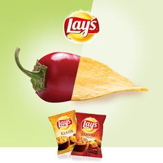 two packets of lays potato chips next to a chili pepper and an eggplant