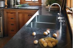 an image of a kitchen setting with eggs on the counter top and stainless steel appliances