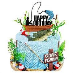 a birthday cake decorated with fishing related items