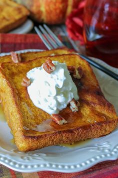 a piece of french toast topped with whipped cream