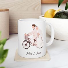 a couple riding a bike together on their wedding day with the bride and groom holding hands