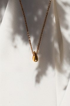 "Beautiful Waterdrop Minimalist 18k Gold Plated Necklace.  Stainless steel jewellery perfect for daily wear or as a gift. Waterproof, tarnish free and hypoallergenic properties make it perfect for the sensitive skin. * DETAILS * 18k gold plated PVD over stainless steel. Length of the necklace is 42cm with 5cm extension.  Width: 10. Height: 12mm. * SHIPPING * FREE UK tracked shipping with all the orders posted the next day. * PACKAGE * Each order comes in the beautiful KOTI bag, perfect for gifti Necklace Product Photography, Jewellery Photography Inspiration, Jewellery Photography, Skin Details, Jewellery Gifts, Everyday Necklace, Jewelry Photography, Lovely Necklace, Cool Necklaces