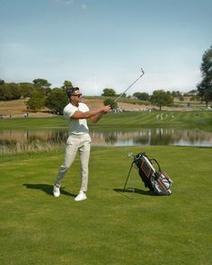 a man is playing golf on the green