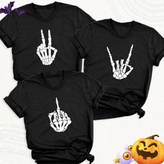 Style and comfort meet with this unique Skeleton Hand T-Shirt! Expressing yourself and reflecting your style has never been as impressive as wearing this special design. Skeleton Hand Shirt, Skeleton Rock Shirt, Funny Halloween Shirt, Halloween Party Shirt, Skeleton Finger Shirt, Halloween Skeleton T-Shirt. Welcome to BestMomentTees! Step into a world of comfort and style with our handmade shirts from the renowned Bella Canvas brand. The solid colors are 100% pure cotton, while the delightful he Skeleton Hand Shirt, Skeleton Finger, Skeleton T Shirt, Initial Design, Handmade Shirts, Custom Design Shirts, Skeleton Hand, Dtf Printing, Halloween Skeleton